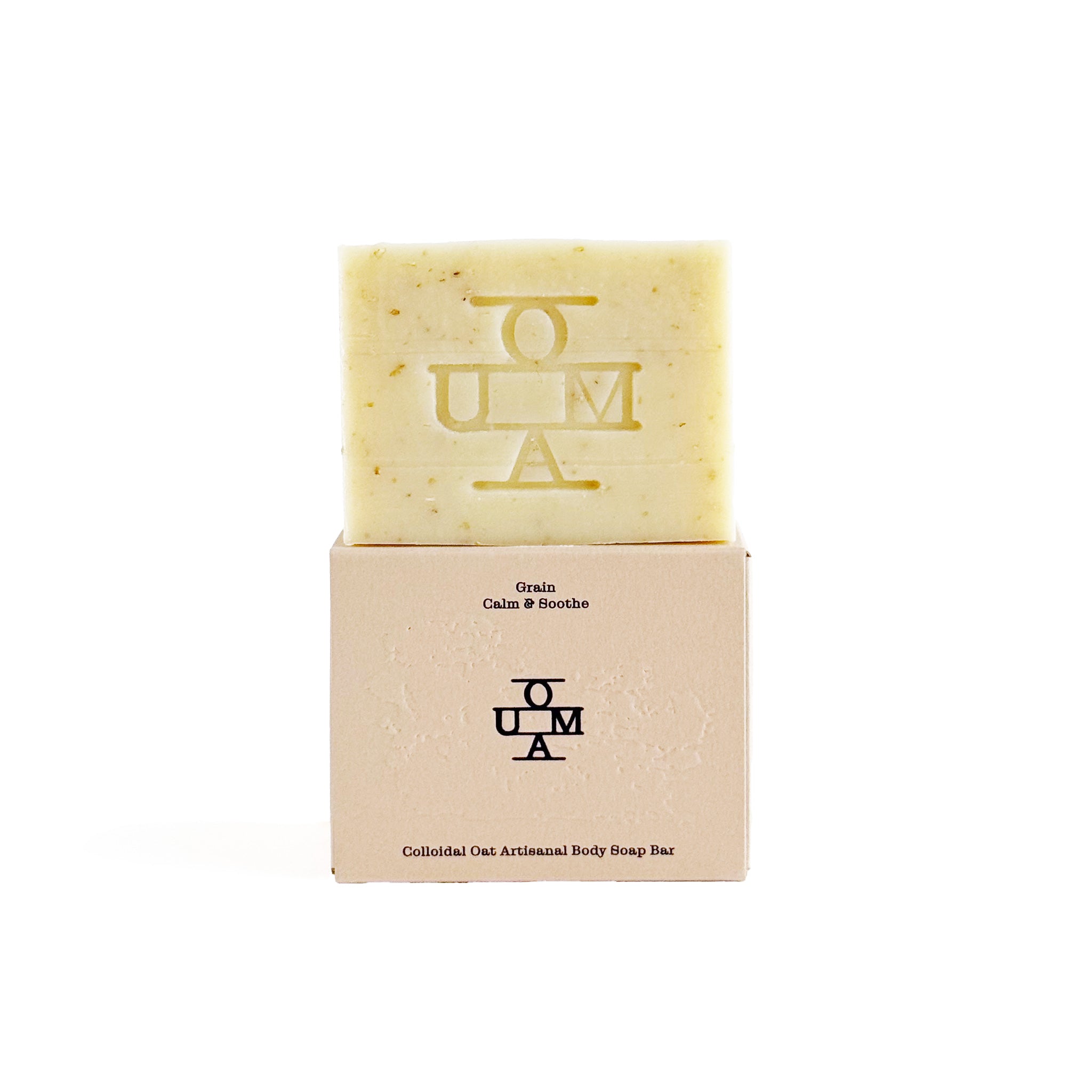No. 001 Grain soap bar with packaging and 'OUMA' branding on a white background