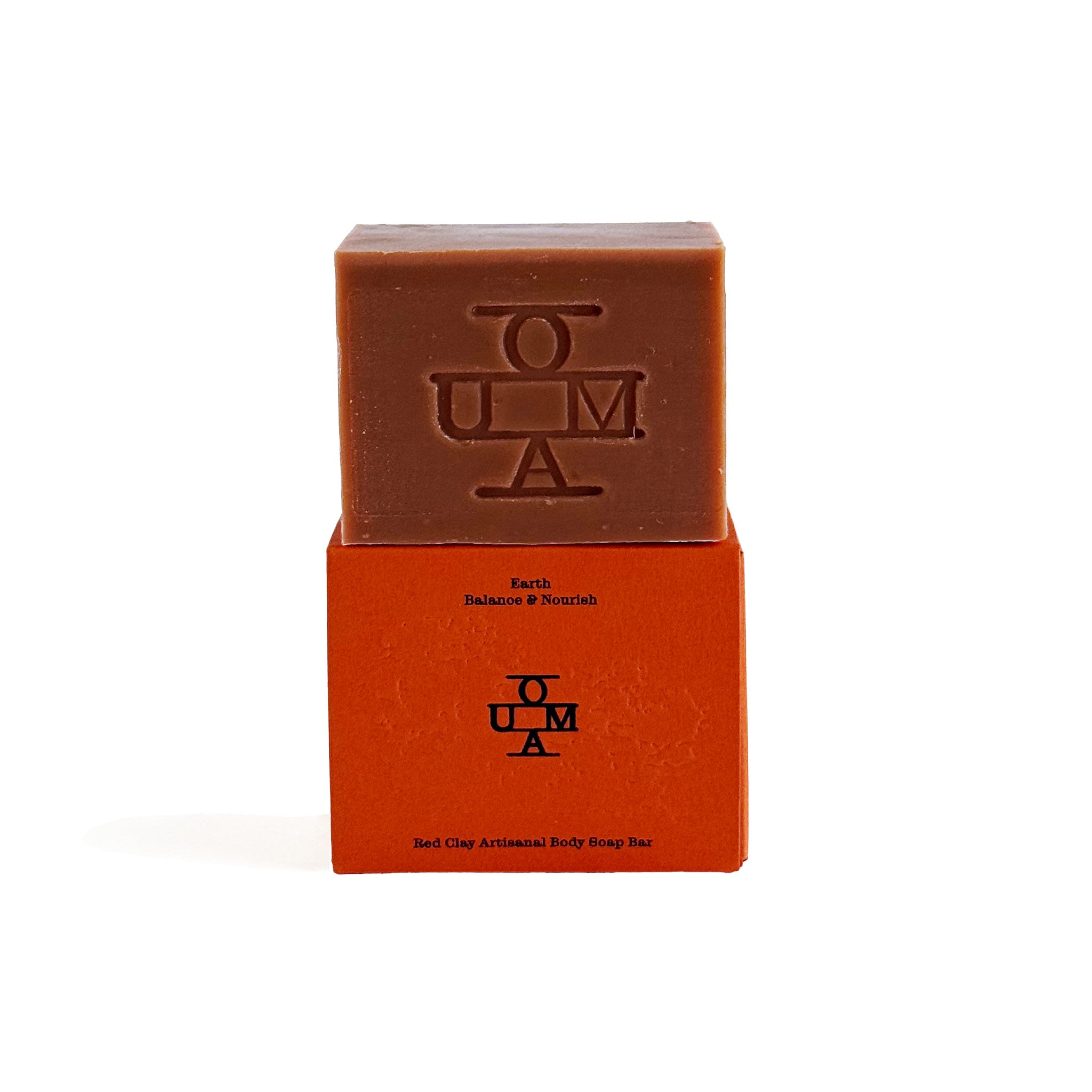 No. 002 Earth soap bar with packaging and 'OUMA' branding on a white background