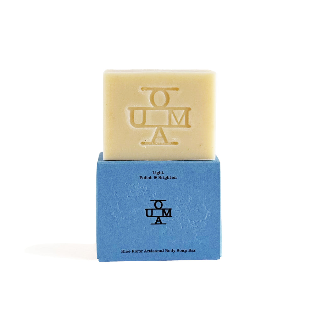 No. 005 Light soap bar with packaging and 'OUMA' branding on a white background